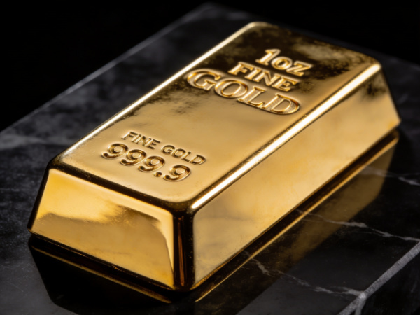 Close-up of a gold bullion bar representing secure precious metals investing.